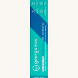 A close up of the turquoise cardboard packaging for the Georganics fluoride free toothpaste with pre and prebiotcs in fresh mint flavour available at Babipur.