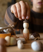 A child playing with the Grapat nin and Ostheimer hedgehog figure from the Grapat Ostheimer hello Autumn set available at Babipur