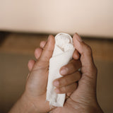 An adult and child's holding a wooden peg doll pieces from the Grapat 2025 advent calendar available at Babipur