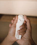 An adult and child's holding a wooden peg doll pieces from the Grapat 2025 advent calendar available at Babipur