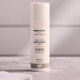 Green People Neutral Light Day Moisturiser - 50ml on a white tiled background