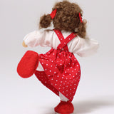 The back of Grimm's Brown Haired Girl Doll - Lana, stood on one leg with the other leg point out behind the doll, showing how flexible the doll is