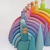 The The Grimm's 12 Pastel Friends stood on top of the Grimm's Pastel Rainbow arches with pastel Grimm's cones as the side.