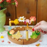 A beautiful sprint time display using a Grimm's Waldorf Celebration Ring, Grimm's decorative figures and Grimm's Candles