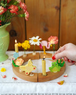 A beautiful sprint time display using a Grimm's Waldorf Celebration Ring, Grimm's decorative figures and Grimm's Candles