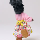 Grimm's Handmade Doll - Mrs Ebony is stood on one foot to show off the flexibility of the doll. The image shows Mrs Ebony from the back and is on a light grey background.