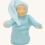 Grimm's Lavender Doll Aqua, is a lovely little waldorf, soft body and handmade doll with a light blue body, pale skin, a smiling face and a light blue night cap. The image is on a cream background