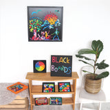 A selection of Grimm's magnetic blackboards with various magnetic pieces on them, to show the different sizes and different works of art