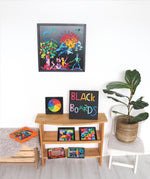 A selection of Grimm's magnetic blackboards with various magnetic pieces on them, to show the different sizes and different works of art