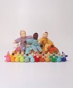 A collection of Grimm's dolls which includes the Grimm's Rainbow Dwarfs, Grimm's Pastel Dwarfs, Grimm's Viola doll, Grimm's Aqua doll, Grimm's Lavender Doll Sun, Grimm's Lavender Doll Aqua, Grimm's Yellow Soft Body Doll,
