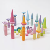 The Grimm's 12 Pastel Friends used in a play scene with other wooden Grimm's Pastel pieces