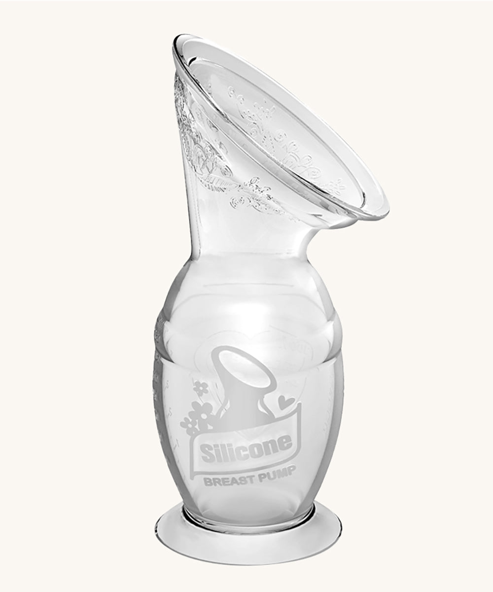 The Haakaa Generation 2 100ml Silicone Breast Pump with Suction Base, on a cream background
