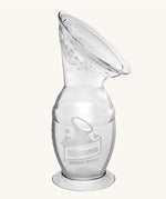 The Haakaa Generation 2 100ml Silicone Breast Pump with Suction Base, on a cream background