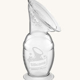 The Haakaa Generation 2 150ml Silicone Breast Pump with Suction Base, on a cream background