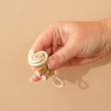 Person demonstrating how to fold a HEVEA LOOP menstrual cup.