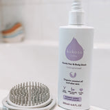 Kokoso unscented organic baby body and hair wash 200ml bottle standing on the side of the bath. Bottle available at Babipur.