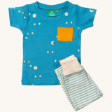 LGR Dawn Organic T-Shirt & Jogger Playset, with a light blue fabric top with moons and stars print and a yellow pocket, and light green and white stripe bottoms