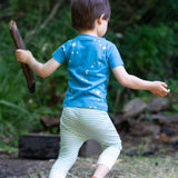 The back of the LGR Dawn Organic T-Shirt & Jogger Playset being worn by a child playing outside