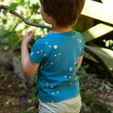 A close up of the moon and star print on the top of the LGR Dawn Organic T-Shirt & Jogger Playset