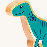 A close up of the chunky wooden Lanka Kade Green Eotyrannus dinosaur figure available at Babipur.