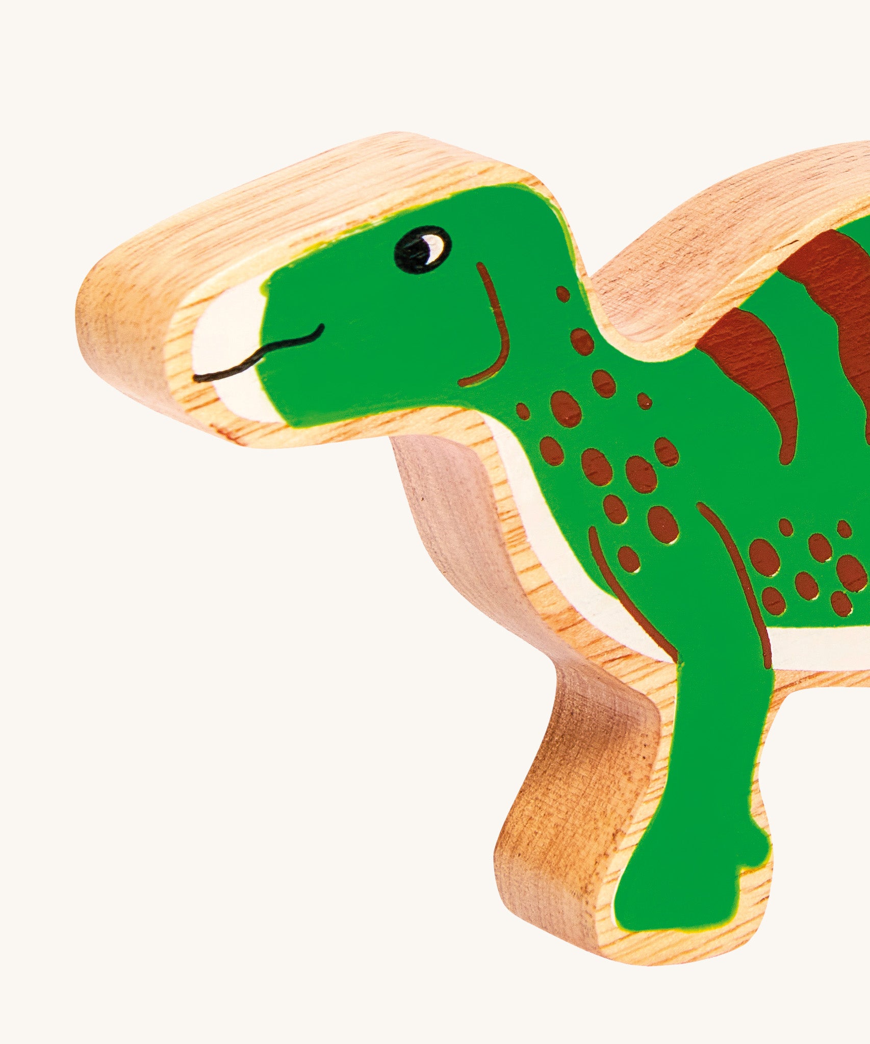 A close up of the Lanka Kade Iguanodon figure available at Babipur. A chunky wooden figure in a shape of a Iguanodon.