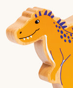A close of the chunky wooden Lanka Kade yellow Becklespinax dinosaur figure available at Babipur.