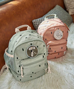 Lassig kids mini caramel and olive pattern backpacks available on Babipur. A pale pink and green backpack with cute patches on the front panel. Features padded shoulder straps, mesh side pockets and 3 zipped compartments.