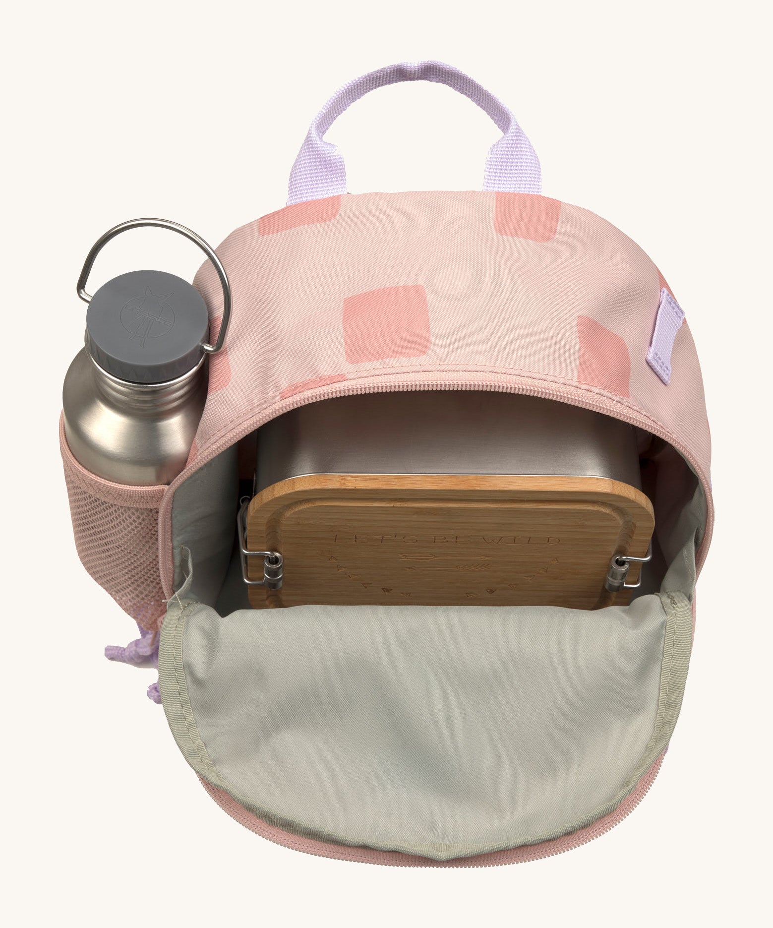 The inside of the Lassig kids mini rose pattern party backpack showing various items  inside the main compartment with a bottle in the mesh side pocket