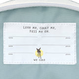 A close up of the name tag on the inside of the Lassig kids tiny backpack in penguin.