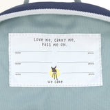 A close up of the name tag on the inside of the Lassig kids tiny backpack in whale.
