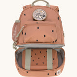The inside of the Lassig kids mini caramel happy print backpack showing a lunchbox inside the bottom compartment.