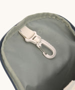 The inside of the Lassig kids mini midnight blue happy print backpack available at Babipur showing the handy clip on the inside