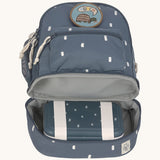 The inside of the Lassig kids mini midnight blue happy print backpack showing a lunchbox inside the bottom compartment.