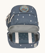 The inside of the Lassig kids mini midnight blue happy print backpack showing a lunchbox inside the bottom compartment.