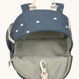 The inside of the Lassig kids mini midnight blue happy print backpack showing the space inside the main compartment.