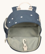 The inside of the Lassig kids mini midnight blue happy print backpack showing the space inside the main compartment.