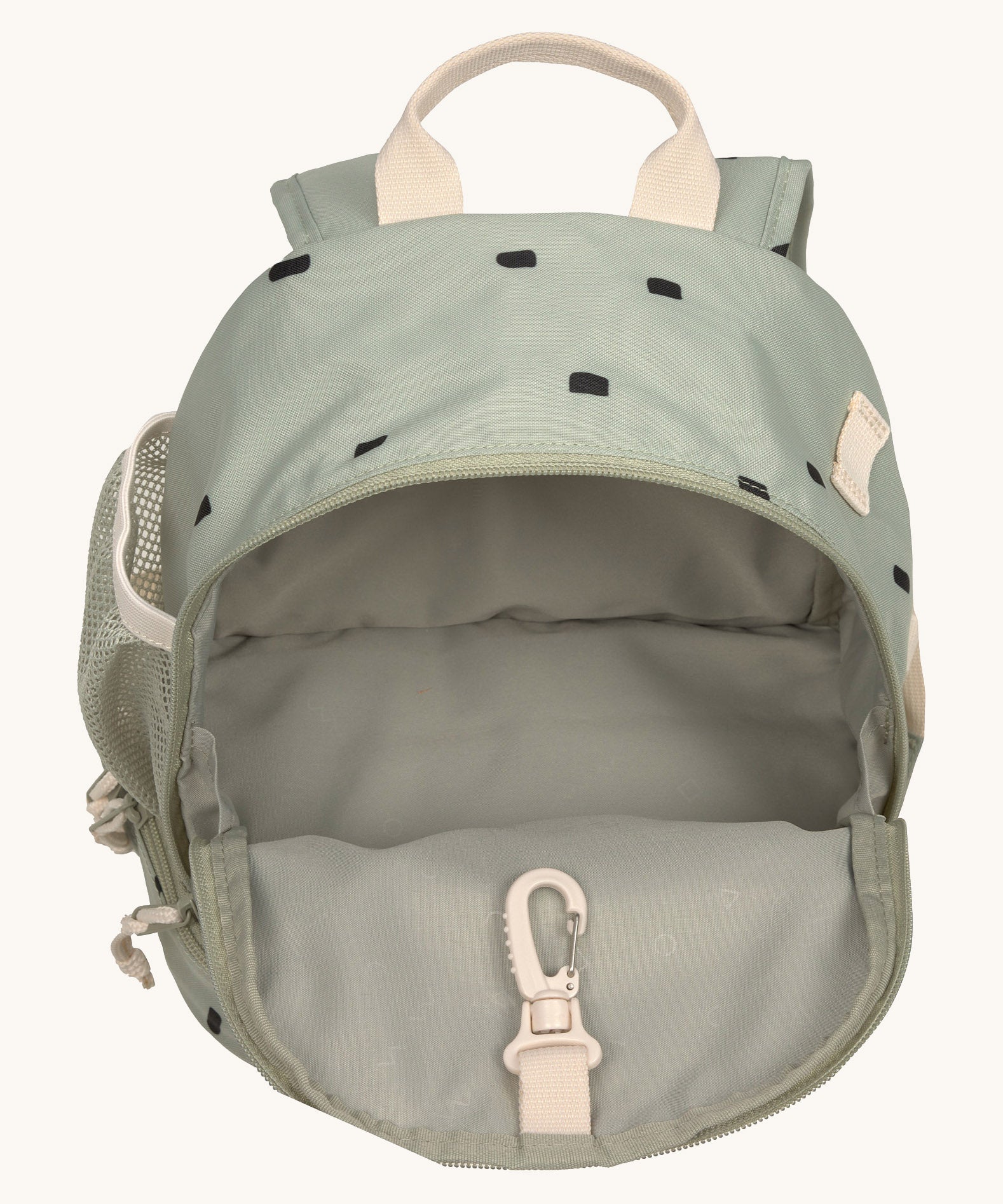 The inside of the Lassig kids mini olive happy print backpack showing the space inside the main compartment.
