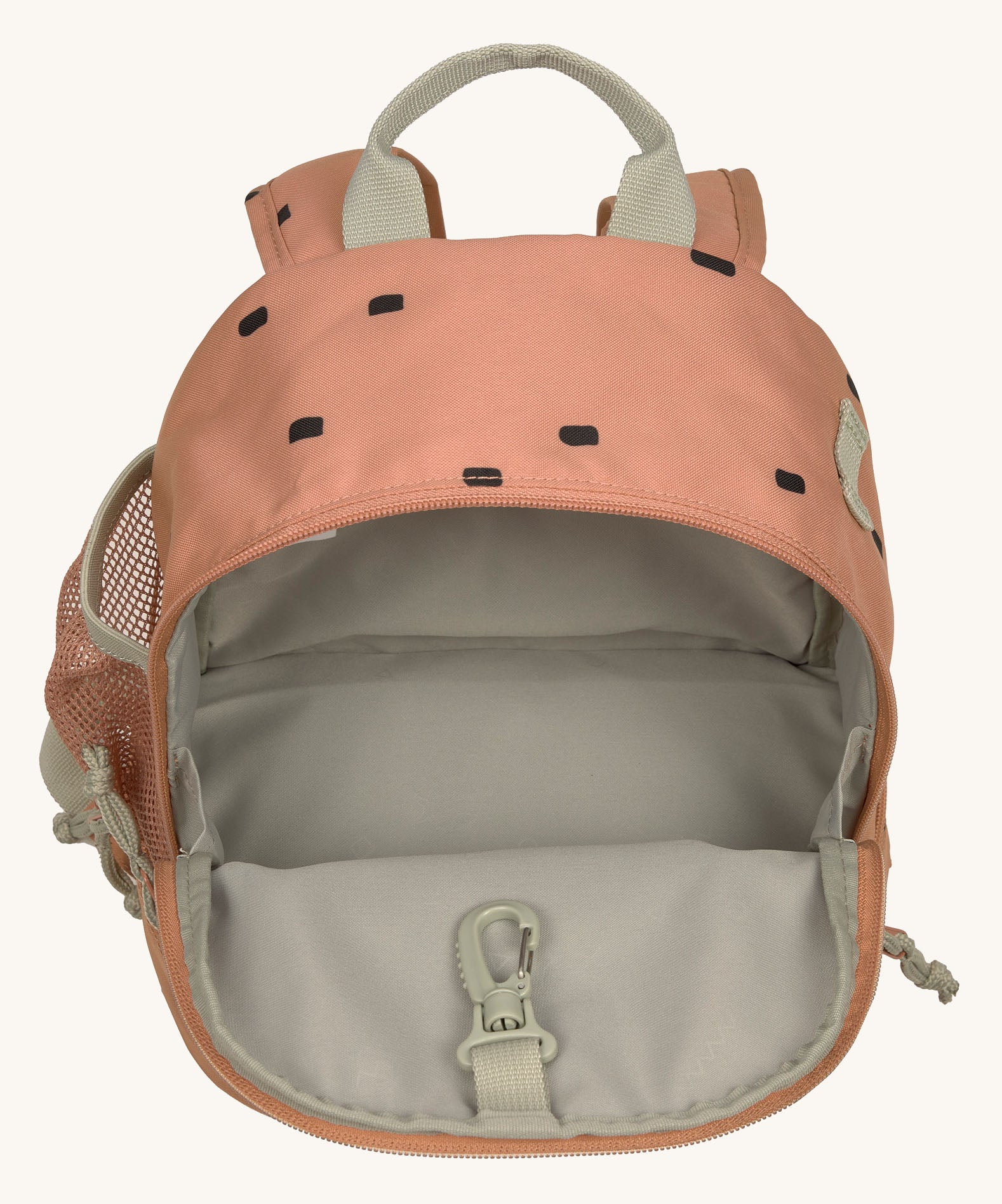 The inside of the Lassig kids mini caramel happy print backpack showing the space inside the main compartment.