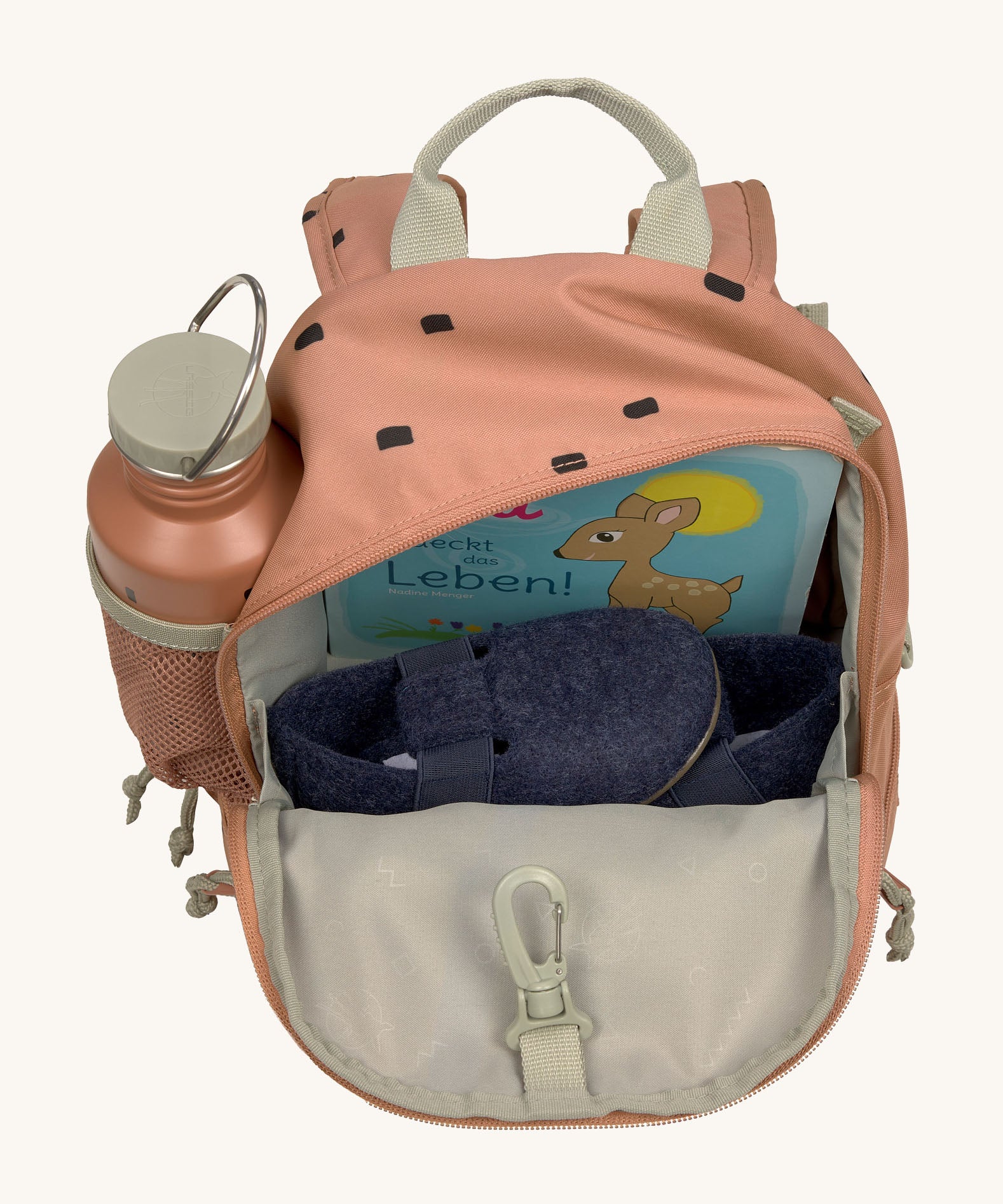The inside of the Lassig kids mini caramel happy print backpack showing various items  inside the main compartment with a bottle in the mesh side pocket