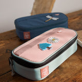 A close up of the Lassig spacy school pencil case in navy and pink showing the black zip detail