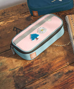 Lassig spacy school pencil case in navy and pink with cute decorative patches on a wooden desk