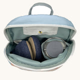 A close up of the Lassig kids tiny balloon backpack showing the bottle holder detail and space inside the main compartment of the backpack