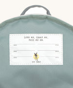 A close up of the white name tag inside the Lassig tiny balloon backpack.