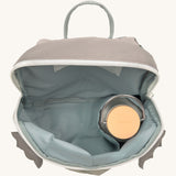 A close up of the Lassig kids tiny dragon backpack showing the bottle holder detail inside the backpack