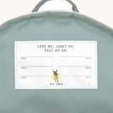 A close up of the white name tag inside the Lassig tiny fire engine backpack.