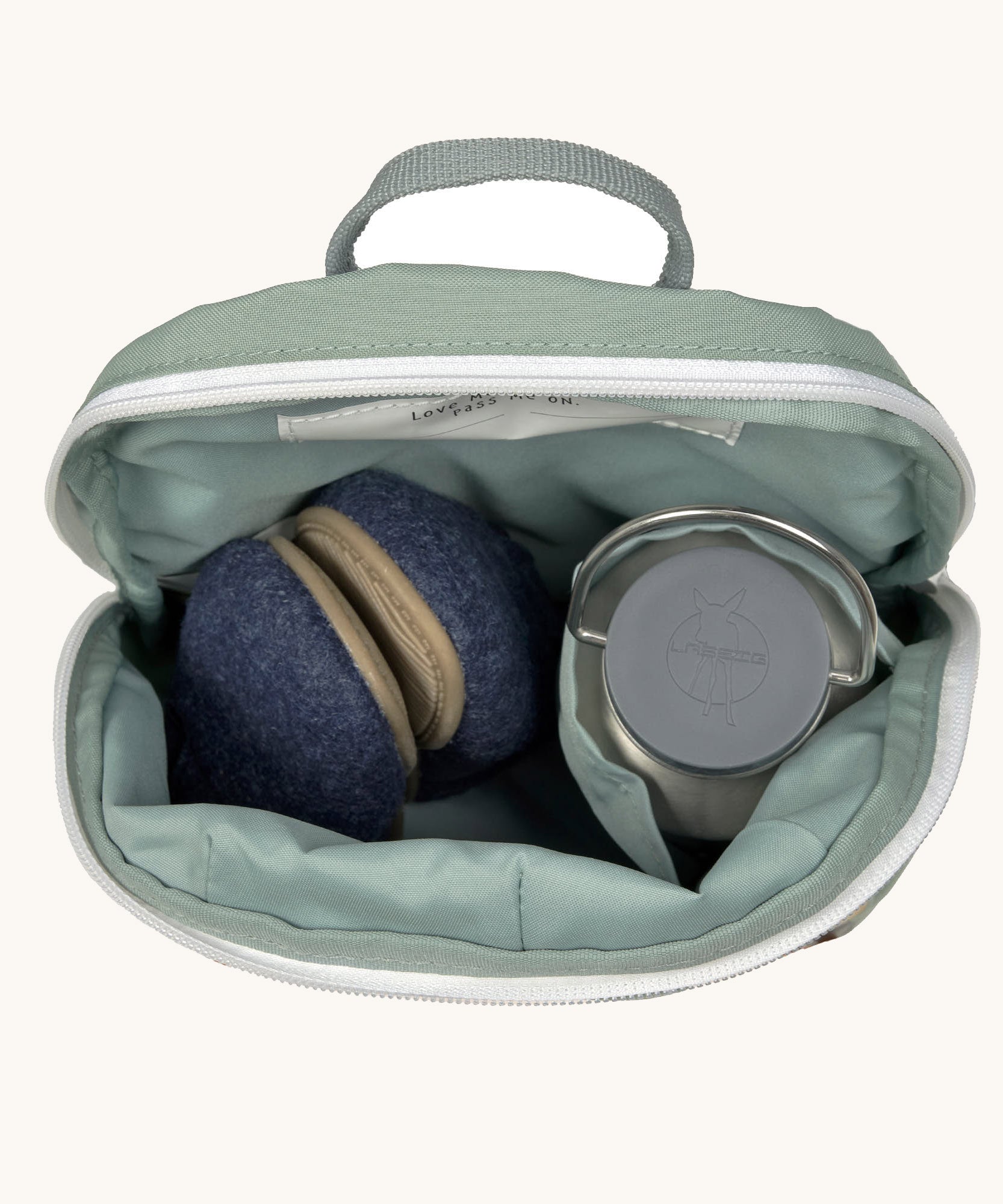 A close up of the Lassig kids tiny digger backpack showing the bottle holder detail and space inside the main compartment of the backpack