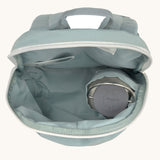 A close up of the Lassig kids tiny backpack in penguin showing the bottle holder detail inside the backpack