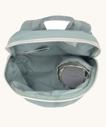 A close up of the Lassig kids tiny backpack in penguin showing the bottle holder detail inside the backpack