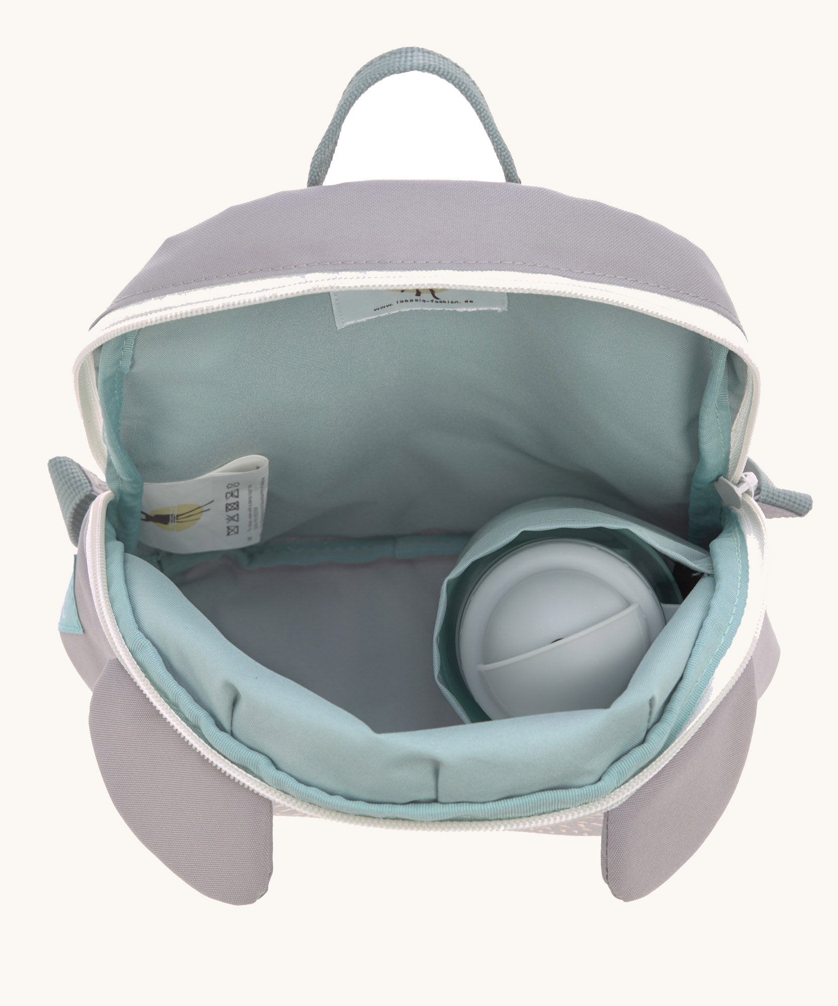 A close up of the Lassig kids tiny koala backpack showing the bottle holder detail inside the backpack