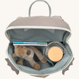 A close up of the Lassig kids tiny dragon backpack showing the bottle holder detail and space inside the main compartment of the backpack